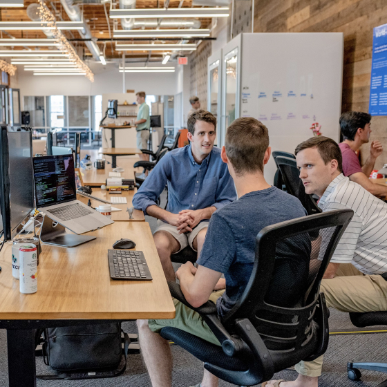 DEALPRINT team collaborating in modern office environment